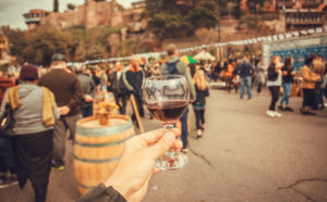 Picture of a food and wine festival - people drinking wine outside