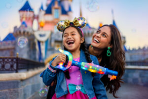 Girl infront of the Disneyland castle