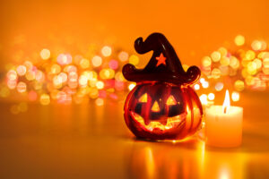 Image of a pumpkin infront of twinkling lights